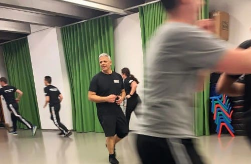 Krav Maga training session in full flow across the hall